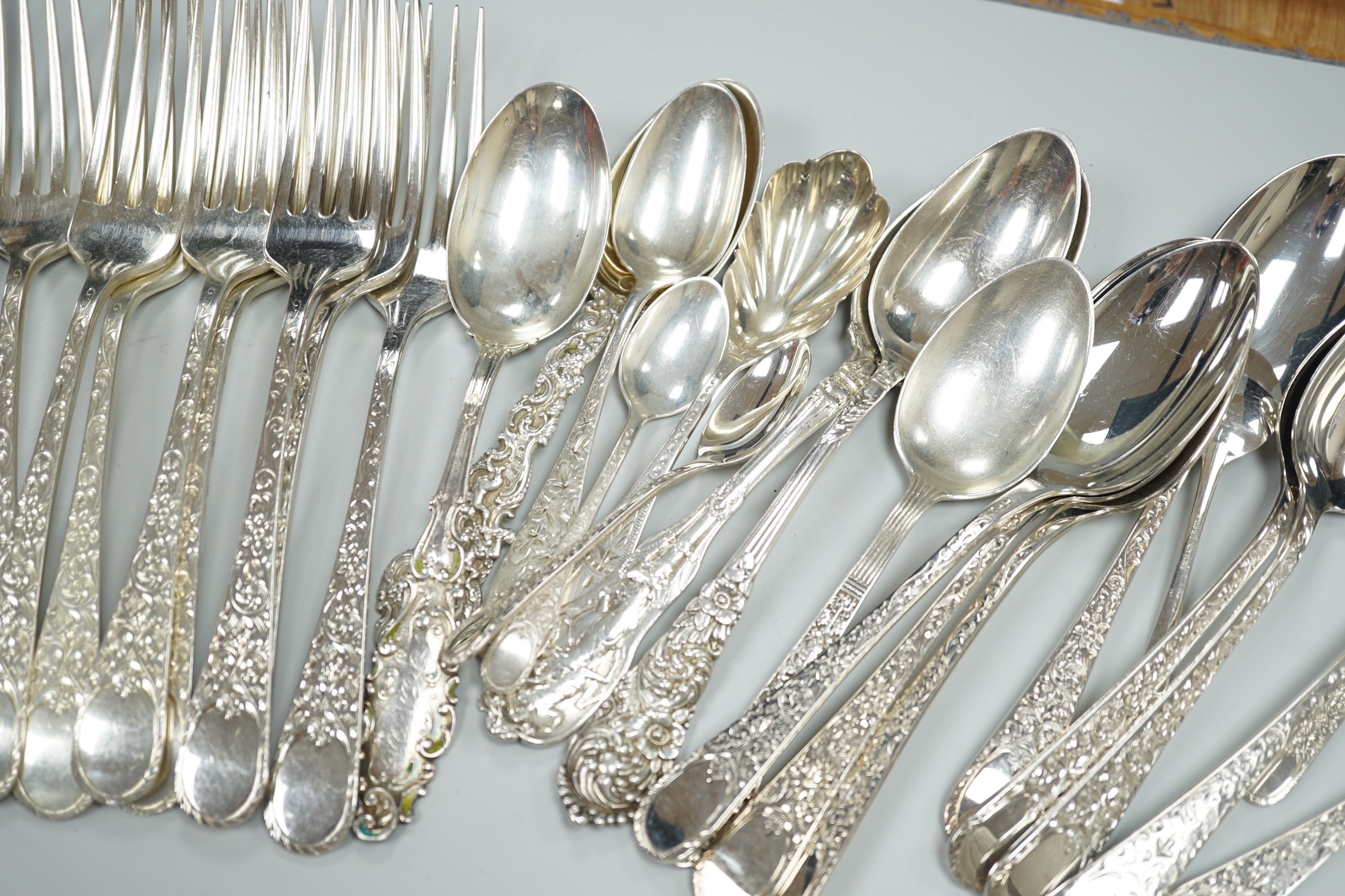 Five Canadian Birks sterling table forks, one sterling teaspoon and six sterling handled table knives, together with seven items of sterling flatware, a Hanau white metal ornate spoon and fifteen items of Birks Regency p